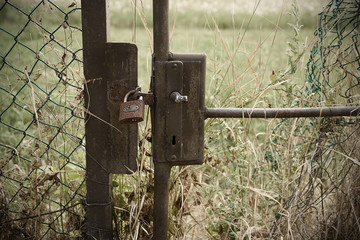 Abandoned closed garden gate