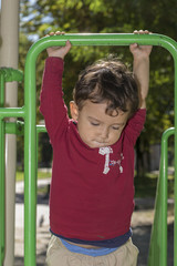 Fototapeta premium boy 2 years playing in the Playground
