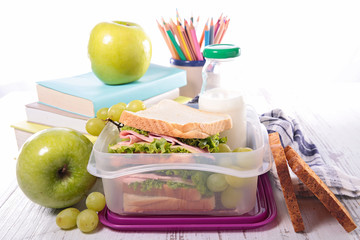 sandwich with fruit and school supply