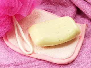 pink towels and bath puff with white soap