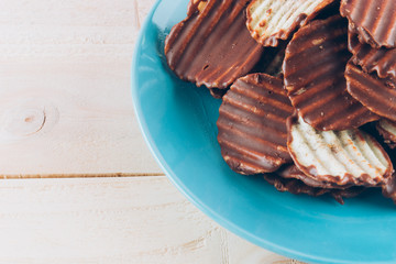 potato chip with chocolate on wood