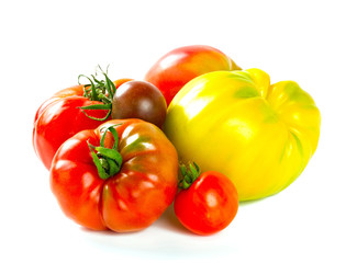 assorted tomatoes isolated on white