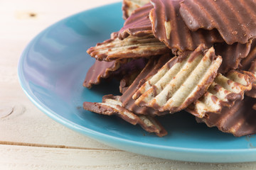 potato chip with chocolate on wood