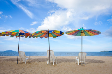 Fototapeta na wymiar Beach chair and umbrella on sand beach