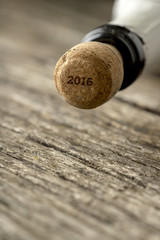 Fototapeta na wymiar Top of the champagne bottle with 2016 sign on the cork