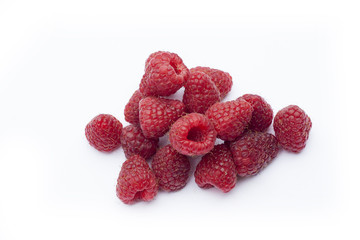 Fresh sweet red raspberry with leaves isolated on white