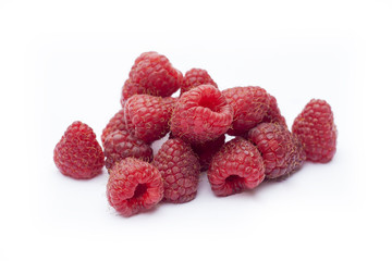 Fresh sweet red raspberry with leaves isolated on white