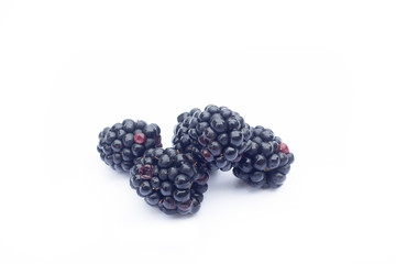 Fresh sweet blackberries with leaves isolated on white, selective focus