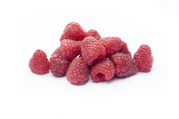 Fresh sweet red raspberry with leaves isolated on white