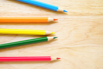 Color pencils on wood background