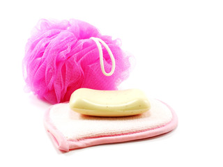 pink towels and bath puff with white soap