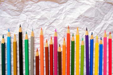 Color pencils on Crumpled white paper background