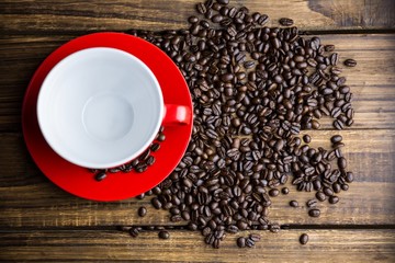 Coffee beans on a table with cup