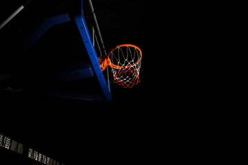 Basketball hoop on black background with light effect