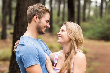 Young happy hiker couple looking at each other