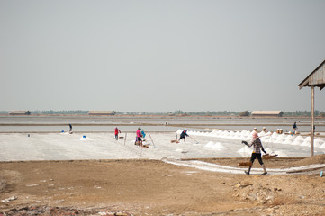 Farmer working at Salt pile in Thailand