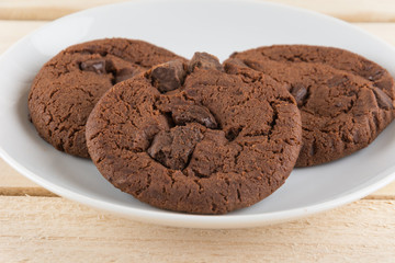 soft dark chocolate brownie cookies on wood