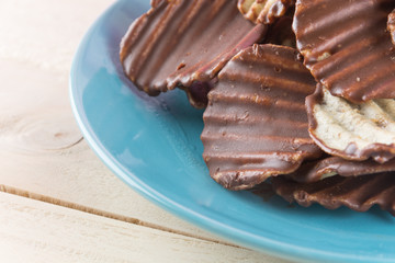 potato chip with chocolate on wood