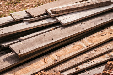 Pile of old wood logs from old house.
