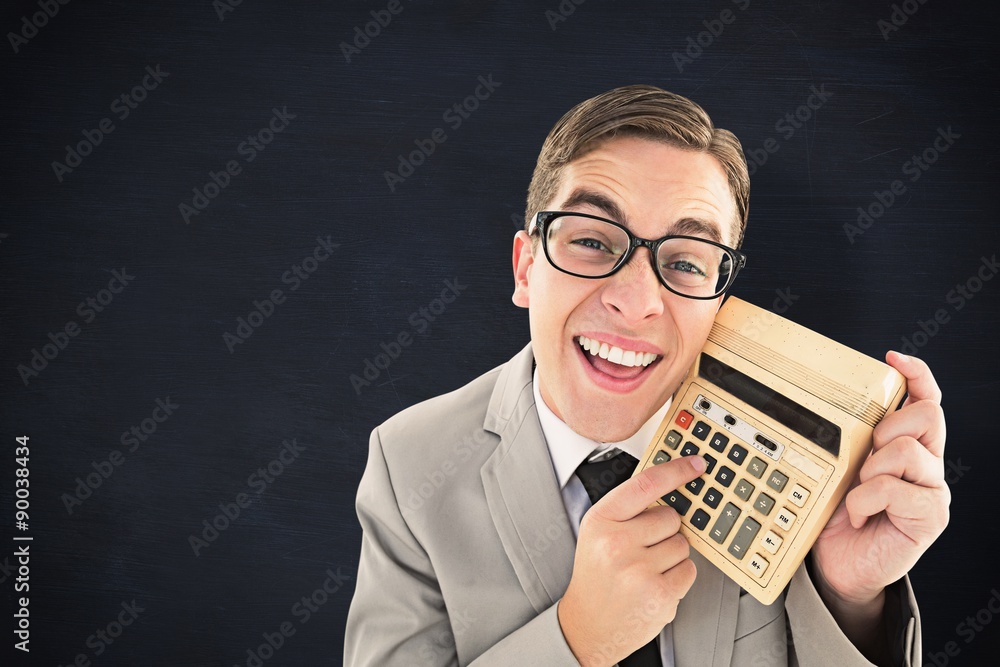 Poster composite image of geeky smiling businessman showing calculator