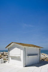 Small white cottage by the sea