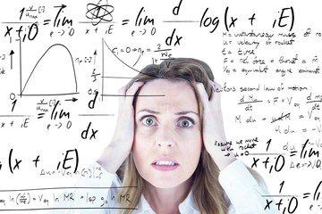 Fototapeta premium Composite image of stressed businesswoman with hands on her head