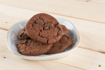 soft dark chocolate brownie cookies on wood