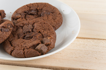 soft dark chocolate brownie cookies on wood