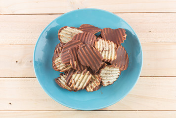 potato chip with chocolate on wood