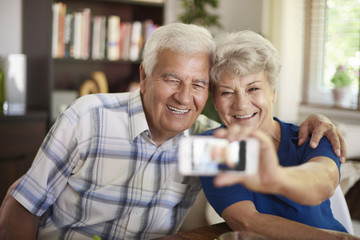 Grandparents taking a selfie with their smartphone
