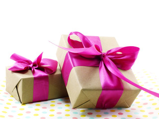 gift box wrapped in recycled paper with ribbon bow