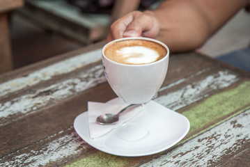 Coffee cup top view on old wooden