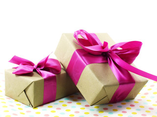 gift box wrapped in recycled paper with ribbon bow