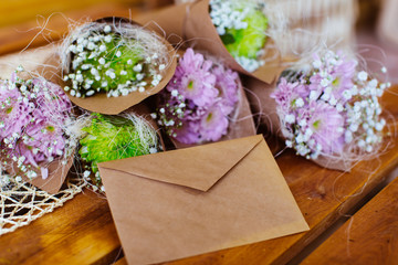 Flowers and macaroon in the box with mail envelope