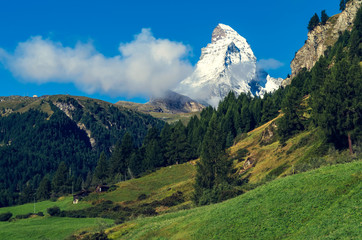Fototapeta premium The beautiful mountain Matterchorn with clouds. Switzerland