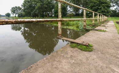 Fototapeta premium Details of an old and abandoned bridge
