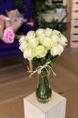 Bouquet of white roses in a glass vase