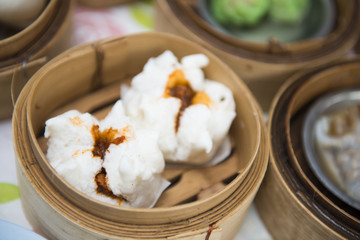Fresh BBQ Pork Buns in wooden basket