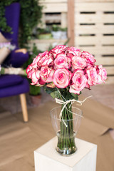 Bouquet of pink roses in a glass vase