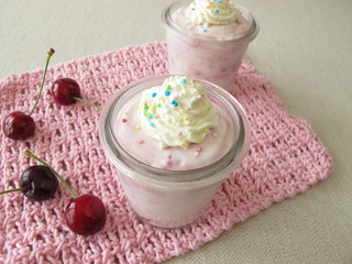 Cherry ice cream with whipped cream