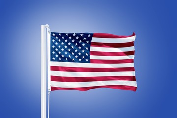 Flag of USA flying against a blue sky