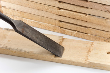 chisel with wood on white background