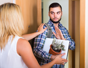 Young couple separating after quarrel .