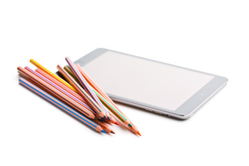 colour pencils and computer tablet