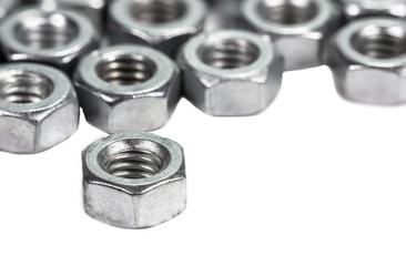 Closeup metal screw (bolt) and nuts on white background.