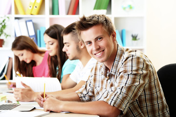 Young students sitting in classroom
