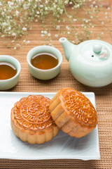 Mooncakes. Traditional Mooncak eand hot tea - Chinese cake