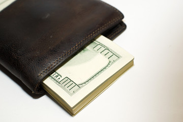 Old  wallet with banknotes of US dollars inside