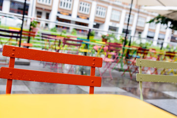 Urban cafeteria with colorful chairs and tables