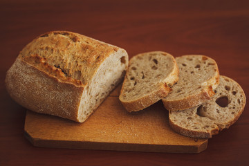 Bread on dark wooden background